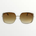 Sunglasses with brown gradient lenses and decorative frame on a white background