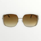 Sunglasses with brown gradient lenses and decorative frame on a white background