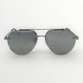 Aviator style sunglasses with gray lenses on a white background