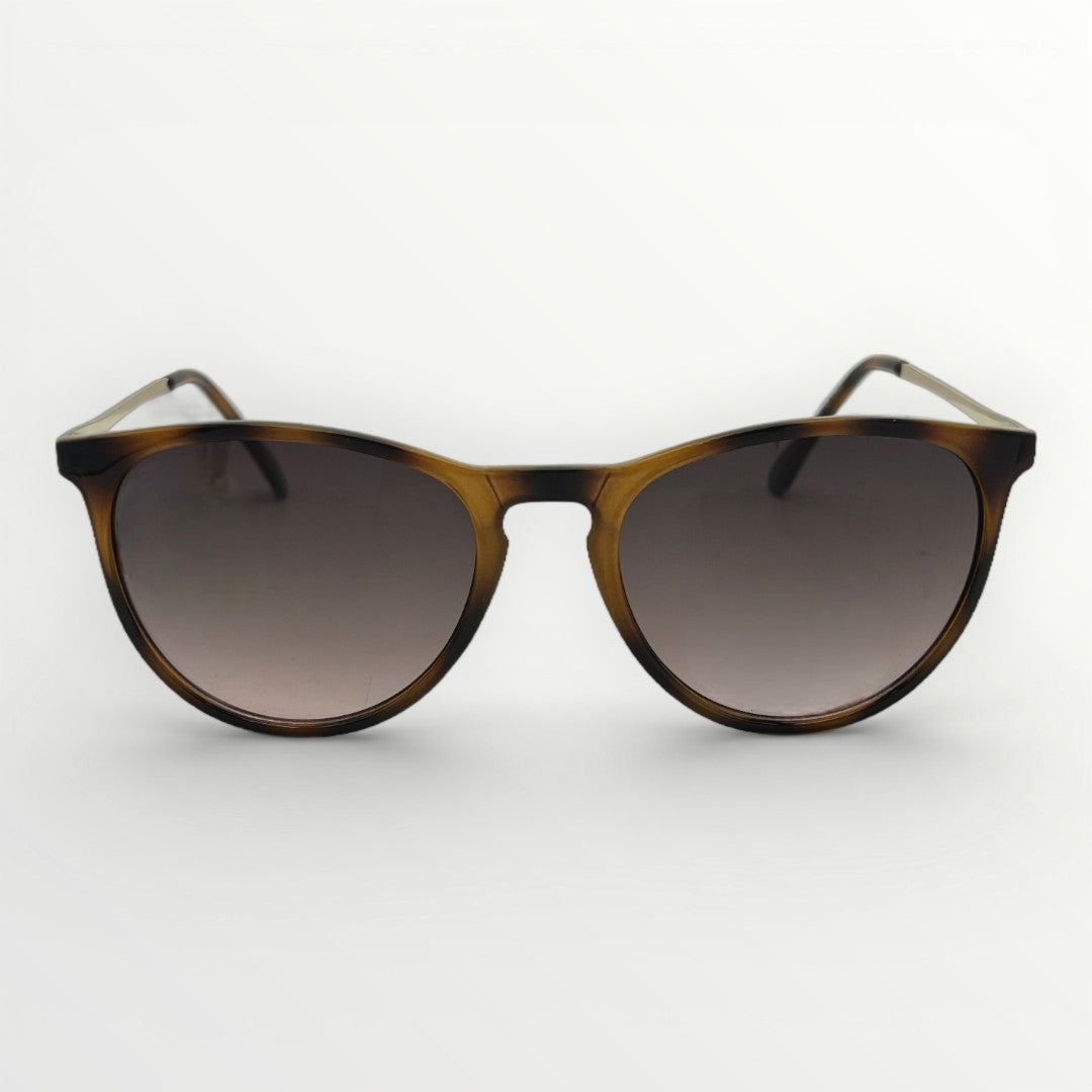 Sunglasses with tortoiseshell frame and gradient lenses on a white background