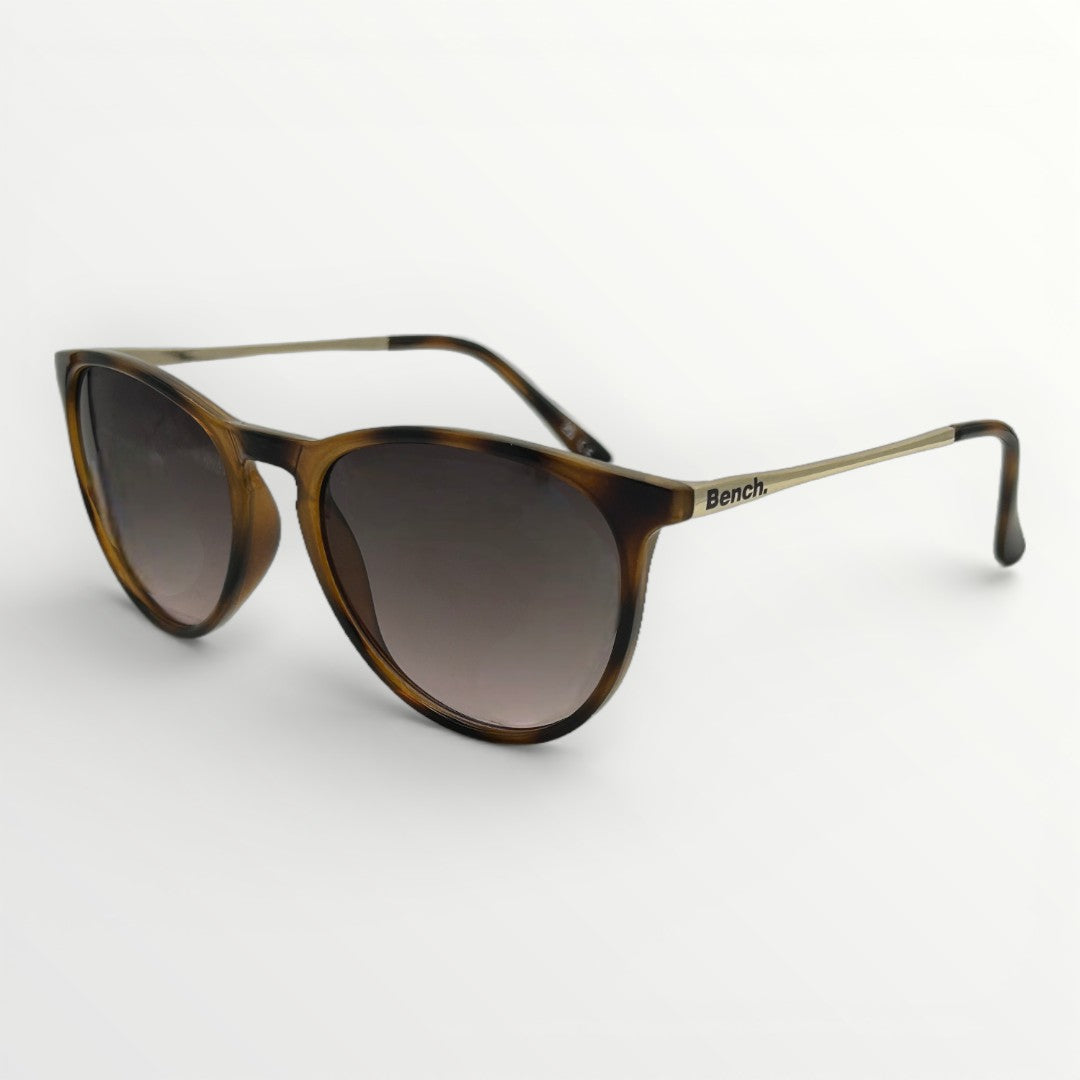 Sunglasses with tortoiseshell frame and dark lenses on a white background