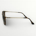 Sunglasses with tortoiseshell frame and dark lenses on a white background