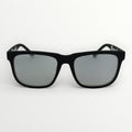 Black sunglasses with silver lenses on a white background