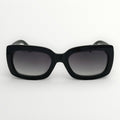 Black sunglasses with gradient lenses on a white background