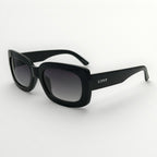 Black sunglasses with gradient lenses on a white background