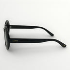 Black sunglasses with 'Lipsy' branding on a white background