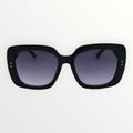 Black sunglasses with gradient lenses on a white background