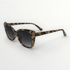 Sunglasses with tortoiseshell frame and dark lenses on a white background