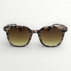 Sunglasses with a tortoiseshell frame and gradient lenses on a white background