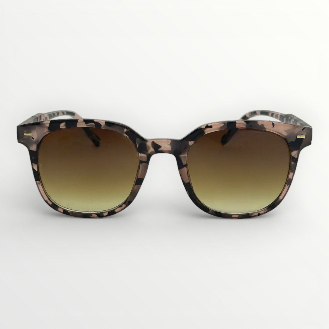 Sunglasses with a tortoiseshell frame and gradient lenses on a white background