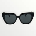 Black cat-eye sunglasses on a white background