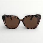 Sunglasses with leopard print frame and brown lenses on a white background