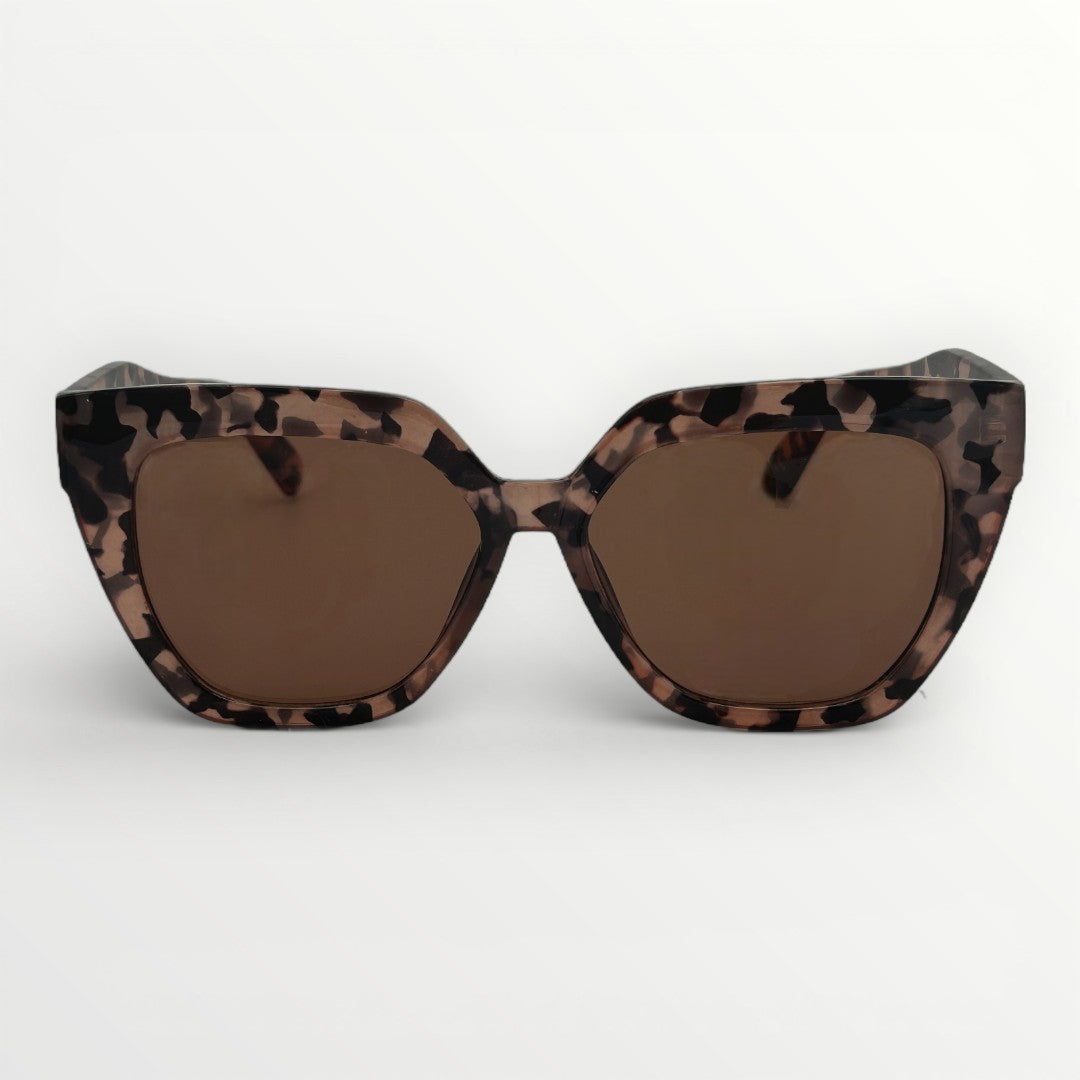 Sunglasses with leopard print frame and brown lenses on a white background