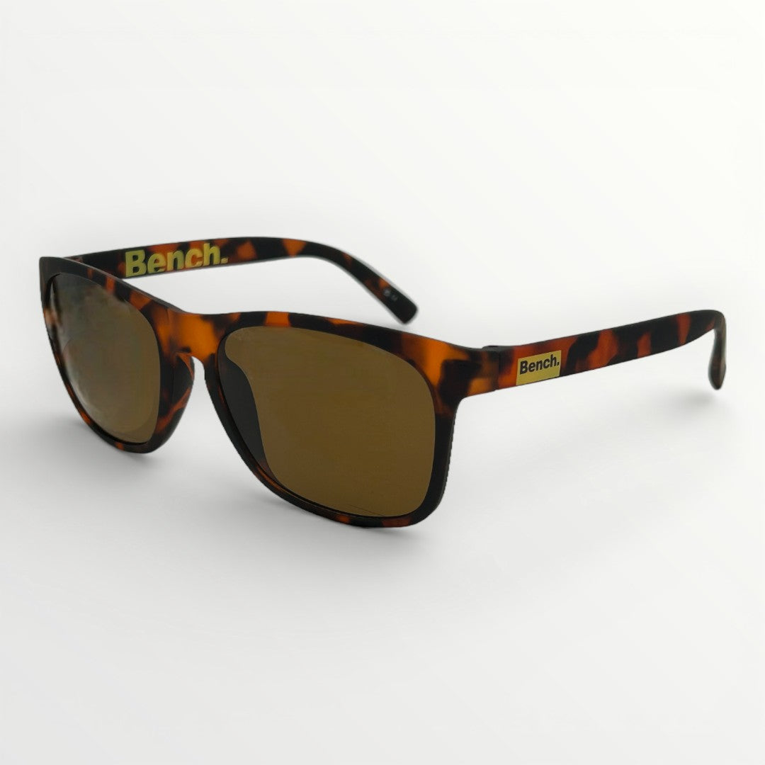 Sunglasses with tortoiseshell frame and brown lenses on a white background