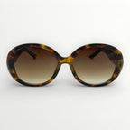 Sunglasses with tortoiseshell frame and brown gradient lenses on a white background