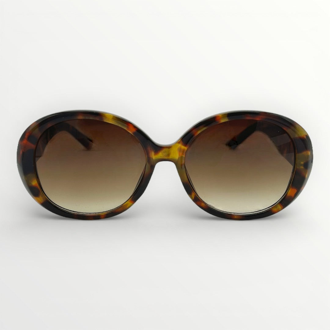Sunglasses with tortoiseshell frame and brown gradient lenses on a white background