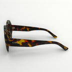 Tortoiseshell sunglasses with 'Lipsy' branding on a white background
