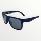 Navy blue sunglasses with a white pattern on the frame against a white background