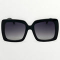 Black sunglasses with gradient lenses on a white background