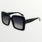 Black sunglasses with gradient lenses on a white background