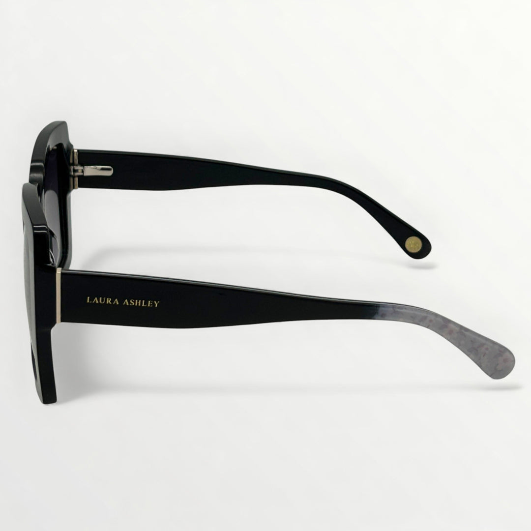 Black sunglasses with 'Laura Ashley' branding on a white background