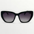 Black sunglasses with gradient lenses on a white background