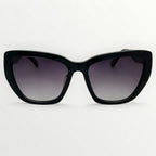 Black sunglasses with gradient lenses on a white background