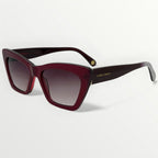 Sunglasses with a maroon frame and gradient lenses on a white background