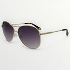 Gold-framed sunglasses with gradient lenses on a white background