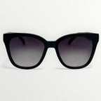 Black sunglasses with gradient lenses on a white background