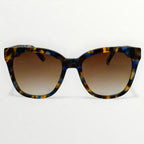 Sunglasses with tortoiseshell frame and brown gradient lenses on a white background