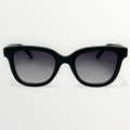 Black sunglasses with gradient lenses on a white background