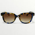 Sunglasses with a tortoiseshell frame and brown gradient lenses on a white background