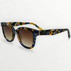 Sunglasses with tortoiseshell frame and gradient lenses on a white background