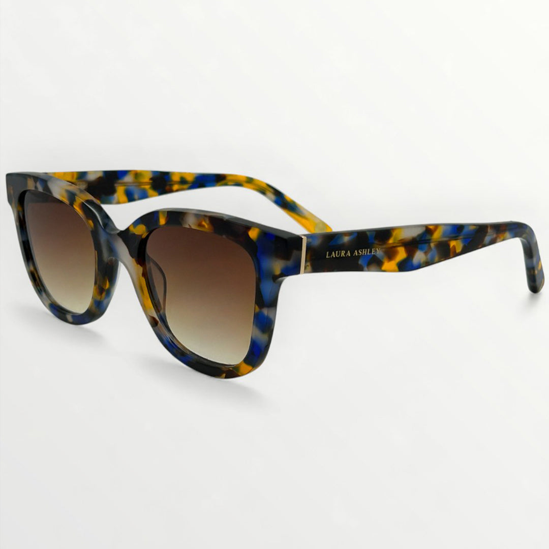 Sunglasses with tortoiseshell frame and gradient lenses on a white background