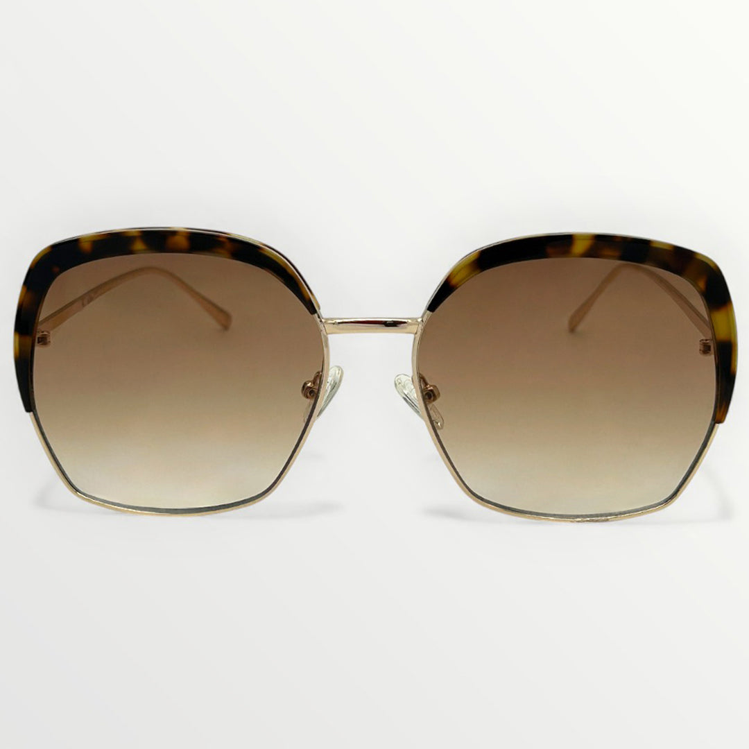 Sunglasses with tortoiseshell frame and brown gradient lenses on a white background