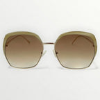 Sunglasses with gold frame and brown gradient lenses on a white background