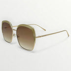 Gold-framed sunglasses with gradient lenses on a white background