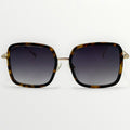 Sunglasses with tortoiseshell frame and dark lenses on a white background