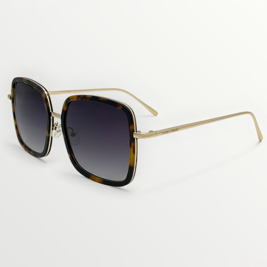 Sunglasses with tortoiseshell frame and dark lenses on a white background