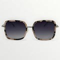 Sunglasses with tortoiseshell frame and dark lenses on a white background