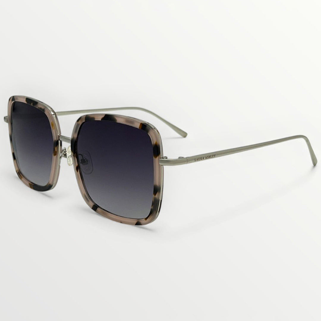 Sunglasses with tortoiseshell frame and dark lenses on a white background