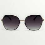 Sunglasses with dark gradient lenses and gold frame on a white background