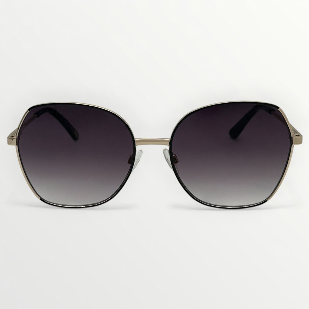 Sunglasses with dark gradient lenses and gold frame on a white background
