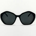 Black sunglasses with dark lenses on a white background