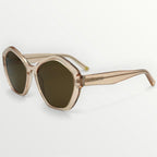 Sunglasses with gold frame and dark lenses on a light gray background