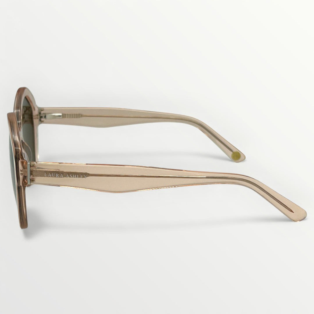 Sunglasses with a beige frame on a light gray background