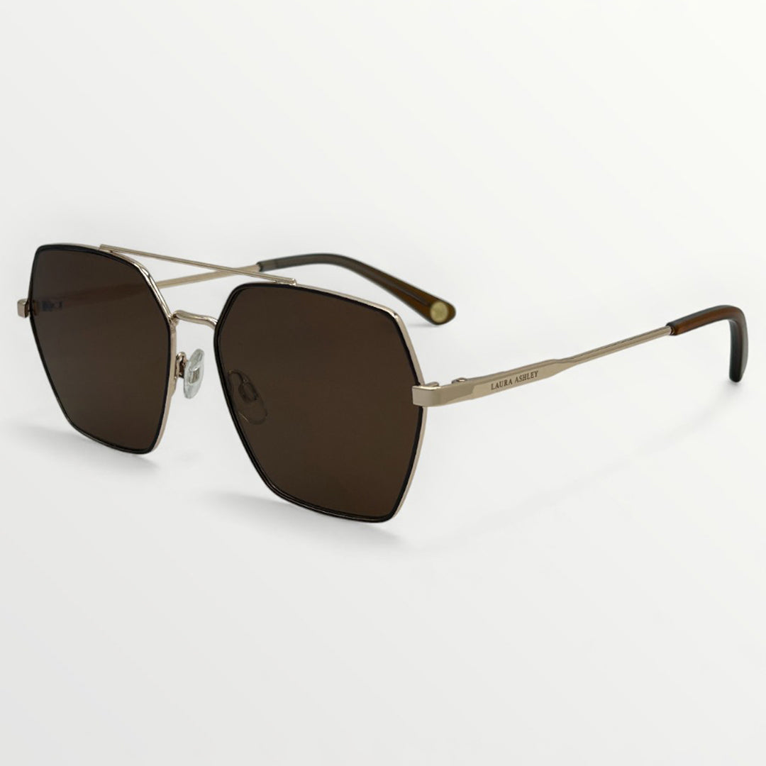 Sunglasses with gold frame and brown lenses on a white background