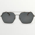 Sunglasses with dark lenses and metallic frame on a white background
