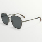Sunglasses with dark lenses and thin metal frame on a white background